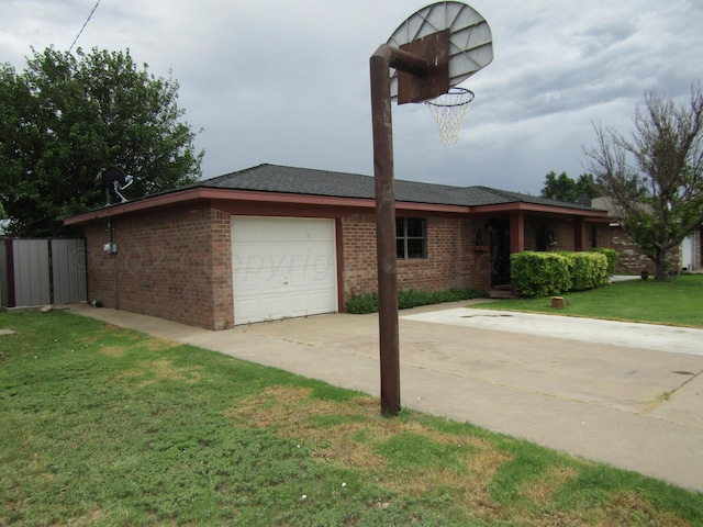 view of front of house with a garage and a front lawn