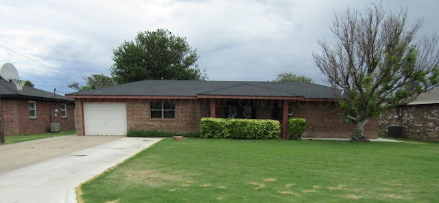 ranch-style home with a garage and a front lawn