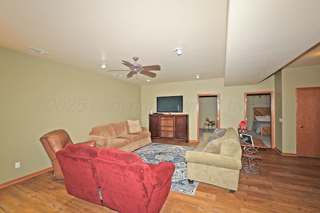 1206 Olive St, Stratford, TX 79084 - living area featuring wood-type flooring and ceiling fan