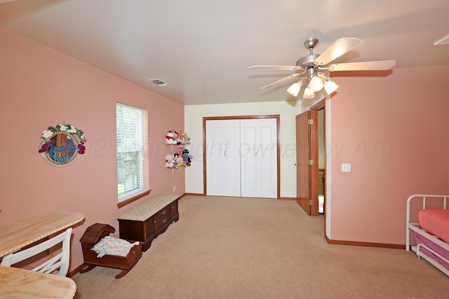 1206 Olive St, Stratford, TX 79084 - bedroom featuring light colored carpet, a closet, and ceiling fan