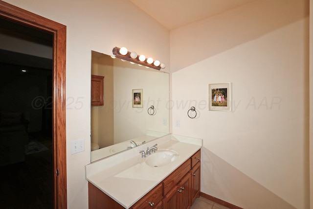 1206 Olive St, Stratford, TX 79084 - bathroom with vanity and tile patterned flooring