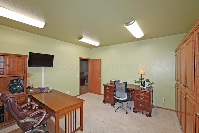 1206 Olive St, Stratford, TX 79084 - home office featuring light colored carpet and baseboards