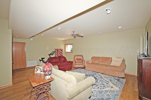 1206 Olive St, Stratford, TX 79084 - living area featuring hardwood / wood-style flooring, ceiling fan, and recessed lighting