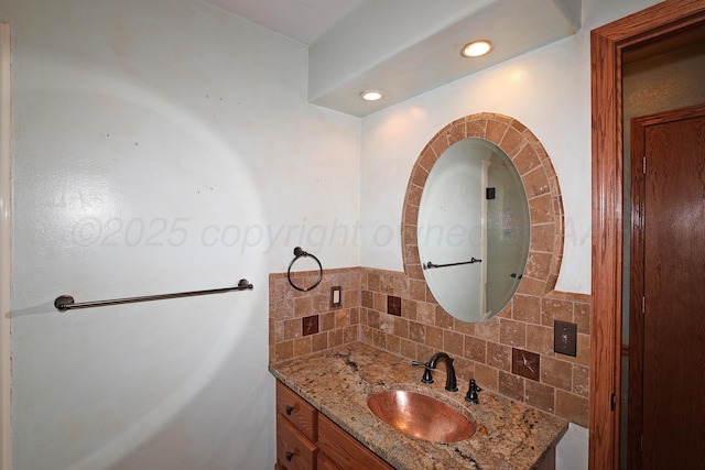 1206 Olive St, Stratford, TX 79084 - bathroom with vanity and decorative backsplash