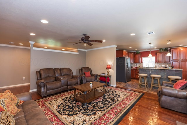 2101 Bowie St, Amarillo, TX 79109 - living area with dark wood-style flooring, a ceiling fan, recessed lighting, and ornamental molding