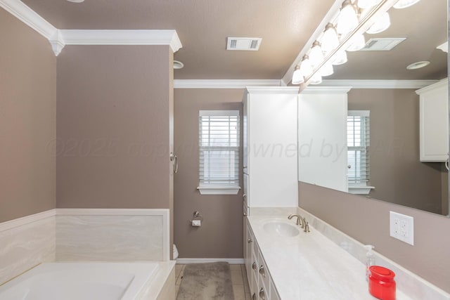 2101 Bowie St, Amarillo, TX 79109 - full bath with vanity, a garden tub, crown molding, healthy amount of natural light, and tile patterned flooring