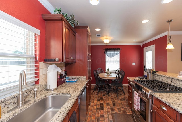 2101 Bowie St, Amarillo, TX 79109 - kitchen with stainless steel appliances, brick flooring, crown molding, recessed lighting, and hanging light fixtures