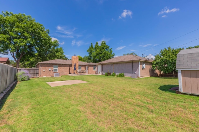 2101 Bowie St, Amarillo, TX 79109 - fenced backyard with a patio and a shed
