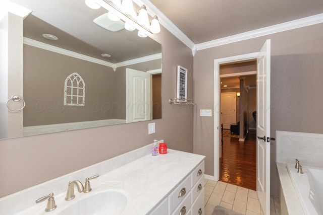 2101 Bowie St, Amarillo, TX 79109 - bathroom featuring ornamental molding, vanity, a garden tub, and tile patterned floors