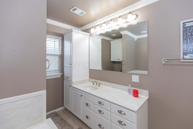 2101 Bowie St, Amarillo, TX 79109 - bathroom with crown molding, vanity, and tile patterned floors