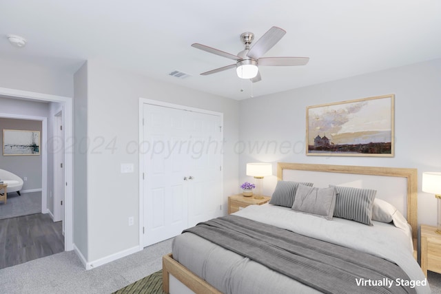 carpeted bedroom featuring ceiling fan and a closet