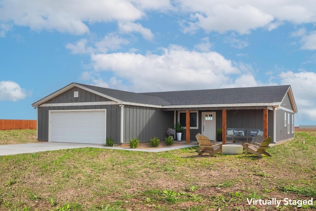 ranch-style home featuring a garage and a front yard