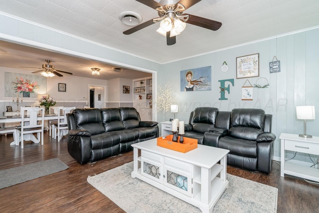 107 Elm St, Hereford, TX 79045 - living room with dark wood-type flooring, ornamental molding, and ceiling fan
