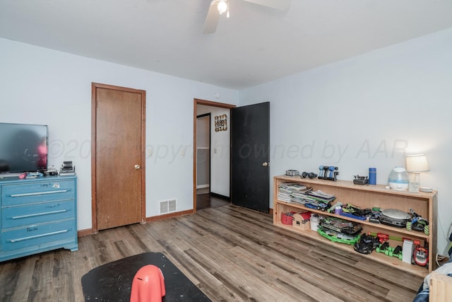 107 Elm St, Hereford, TX 79045 - bedroom featuring baseboards, a ceiling fan, wood finished floors, and visible vents