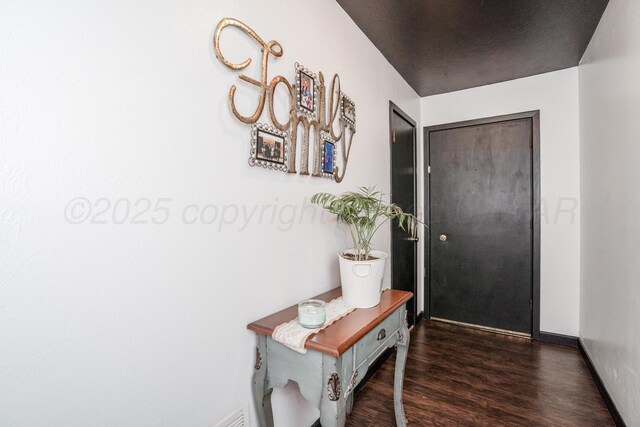 107 Elm St, Hereford, TX 79045 - interior space with baseboards and wood finished floors