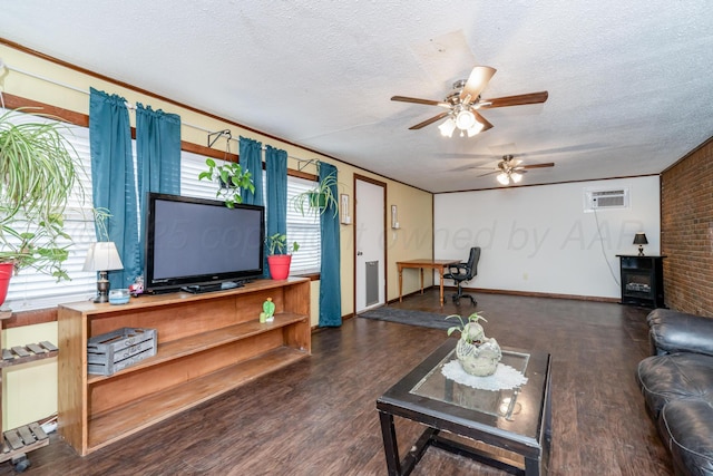 107 Elm St, Hereford, TX 79045 - living area with wood finished floors, a textured ceiling, brick wall, ceiling fan, and baseboards