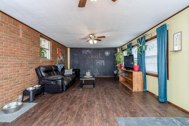107 Elm St, Hereford, TX 79045 - living room featuring ceiling fan, baseboards, wood finished floors, and a textured ceiling