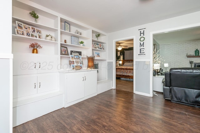 107 Elm St, Hereford, TX 79045 - interior space featuring dark wood finished floors, a ceiling fan, and built in shelves