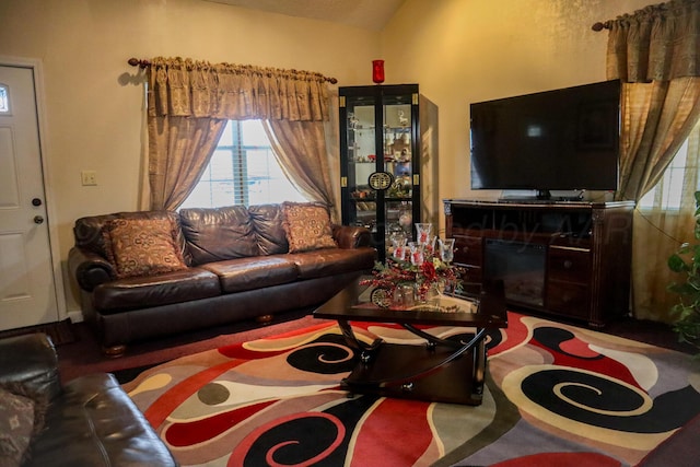 living room featuring vaulted ceiling