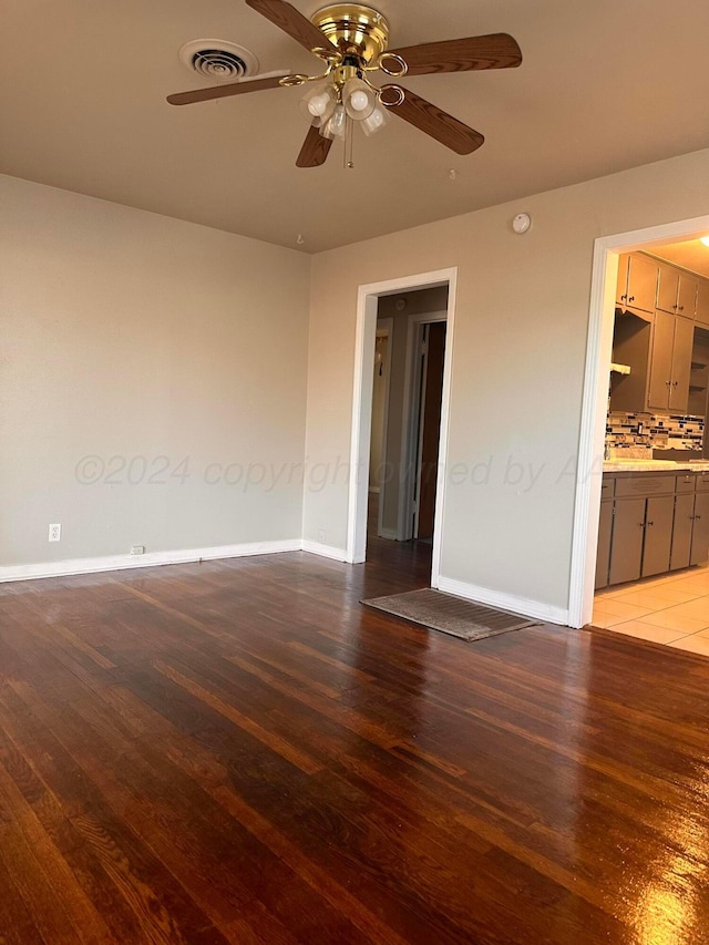 unfurnished room with ceiling fan and light hardwood / wood-style floors