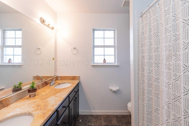2408 Drake Elm Pl, Amarillo, TX 79124 - bathroom with double vanity, plenty of natural light, and curtained shower