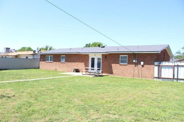 136 NW Dr, Hereford, TX 79045 - rear view of house featuring french doors, a patio, and brick siding