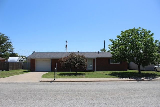 136 NW Dr, Hereford, TX 79045 - single story home with concrete driveway, a garage, brick siding, and roof with shingles