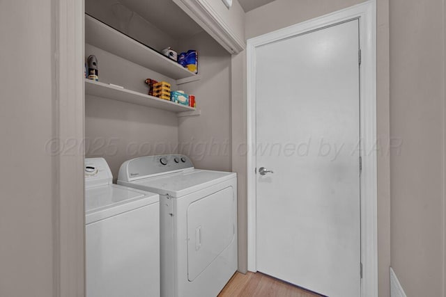312 SW 45th Ave, Amarillo, TX 79110 - laundry area with washer and dryer and light wood-style flooring