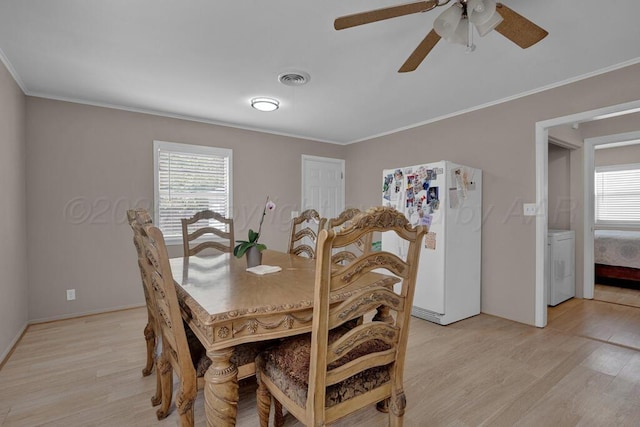 312 SW 45th Ave, Amarillo, TX 79110 - dining area with washer / dryer, light wood-type flooring, plenty of natural light, crown molding, and ceiling fan