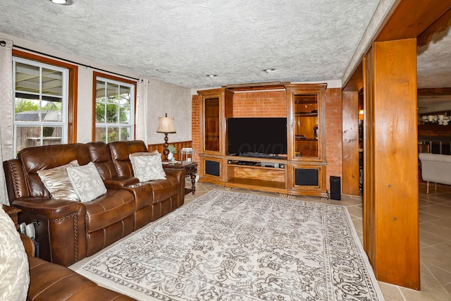 tiled living area featuring a textured ceiling