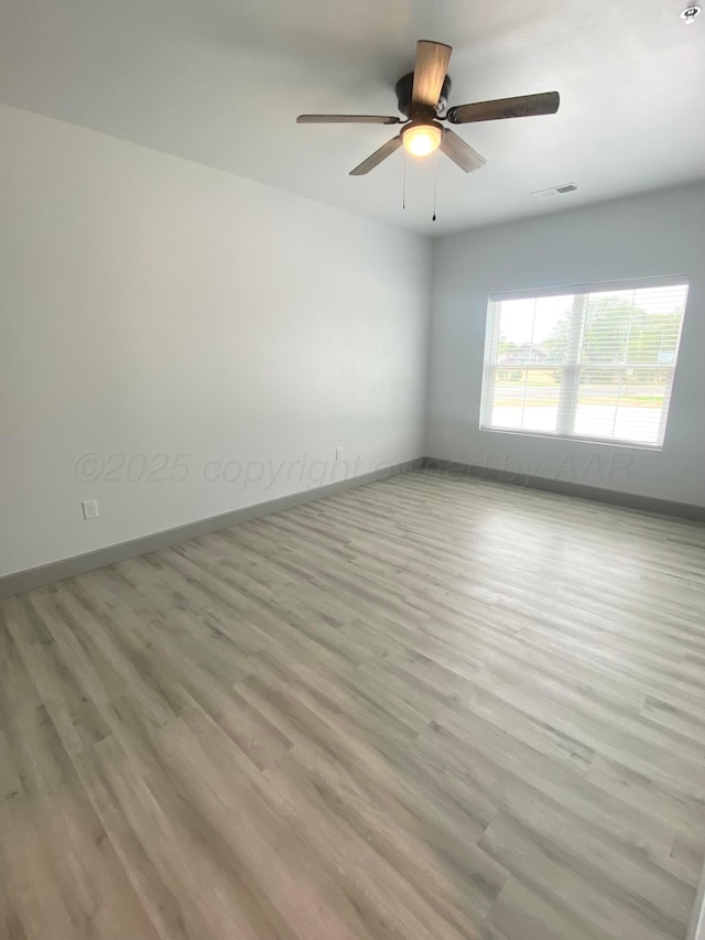 2 S Hunsley Hills Blvd, Canyon, TX 79015 - spare room with wood finished floors, baseboards, and a ceiling fan