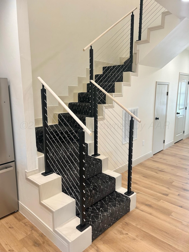 2 S Hunsley Hills Blvd, Canyon, TX 79015 - stairs featuring wood finished floors and baseboards