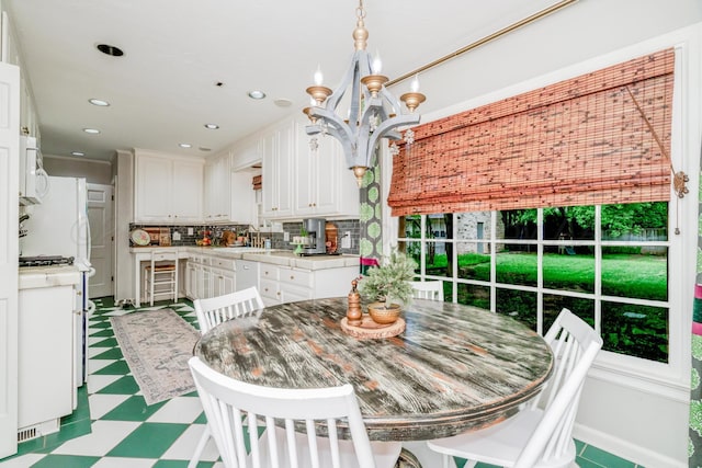 3208 S Ong St, Amarillo, TX 79109 - dining space with a chandelier, tile patterned floors, and recessed lighting