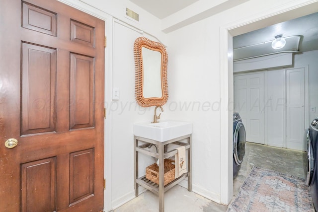 3208 S Ong St, Amarillo, TX 79109 - laundry room with washer / clothes dryer and baseboards