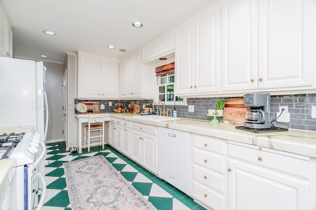 3208 S Ong St, Amarillo, TX 79109 - kitchen with white appliances, light floors, white cabinets, decorative backsplash, and light countertops