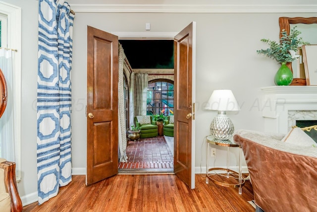 3208 S Ong St, Amarillo, TX 79109 - entrance foyer featuring a fireplace, wood finished floors, and ornamental molding