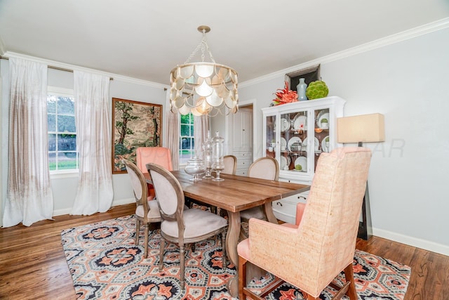 3208 S Ong St, Amarillo, TX 79109 - dining area featuring wood finished floors, crown molding, and a chandelier