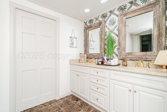 3208 S Ong St, Amarillo, TX 79109 - bathroom featuring double vanity, ornamental molding, marble look tiles, and recessed lighting