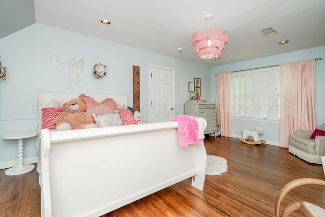 3208 S Ong St, Amarillo, TX 79109 - bedroom with wood finished floors, recessed lighting, and a chandelier