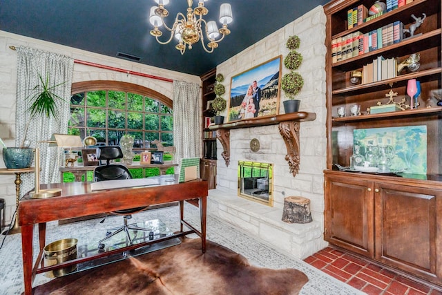 3208 S Ong St, Amarillo, TX 79109 - office area featuring brick patterned floors, a chandelier, and a stone fireplace