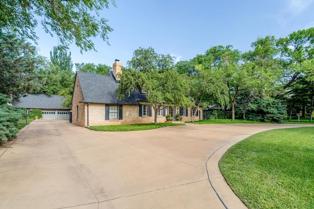 3208 S Ong St, Amarillo, TX 79109 - view of front facade featuring a chimney, a front yard, and a shingled roof