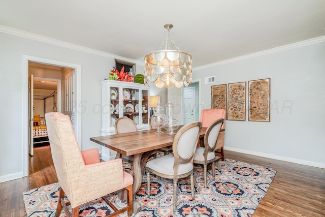 3208 S Ong St, Amarillo, TX 79109 - dining space with a chandelier, wood finished floors, and ornamental molding
