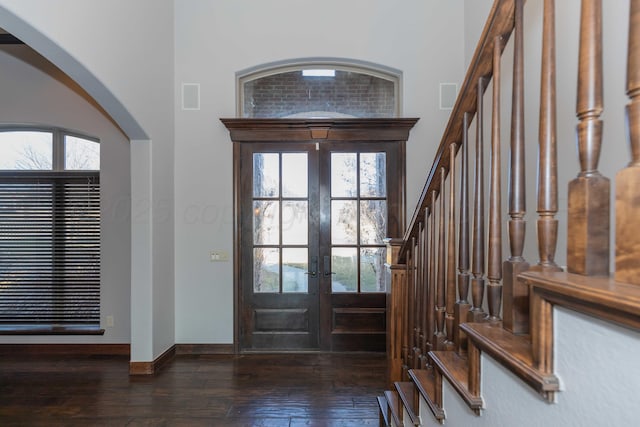 entryway featuring dark hardwood / wood-style flooring and french doors