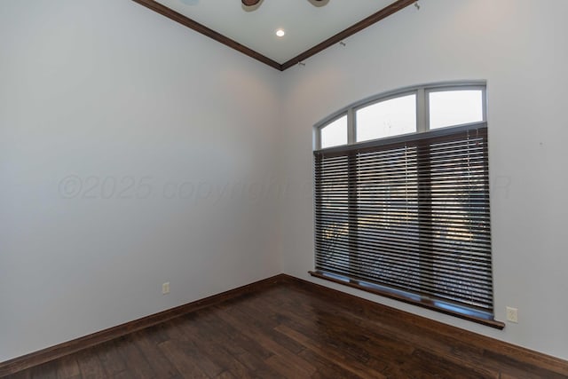 spare room with hardwood / wood-style flooring and crown molding