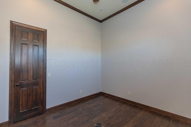 unfurnished room featuring dark hardwood / wood-style flooring and crown molding