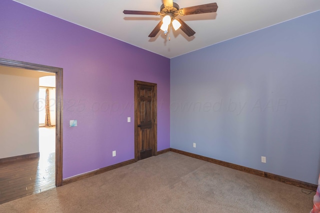 unfurnished room with carpet flooring and ceiling fan