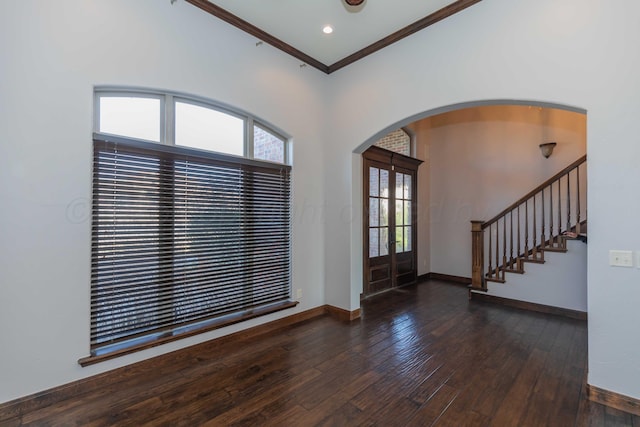 entrance foyer with french doors, dark hardwood / wood-style flooring, and ornamental molding