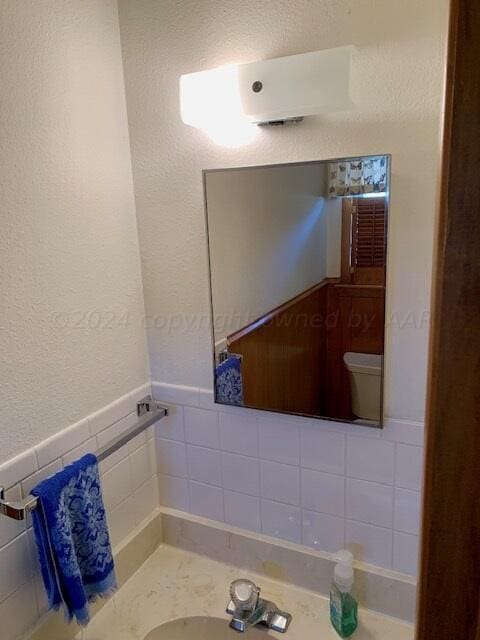 bathroom with toilet and vanity