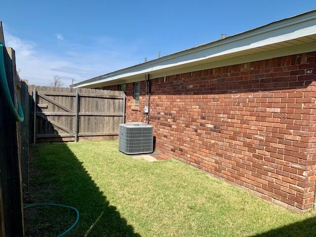 view of yard featuring central AC