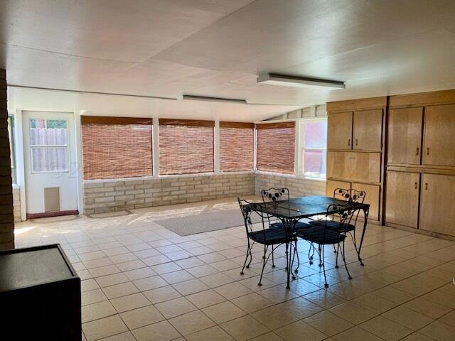 unfurnished dining area with light tile patterned floors